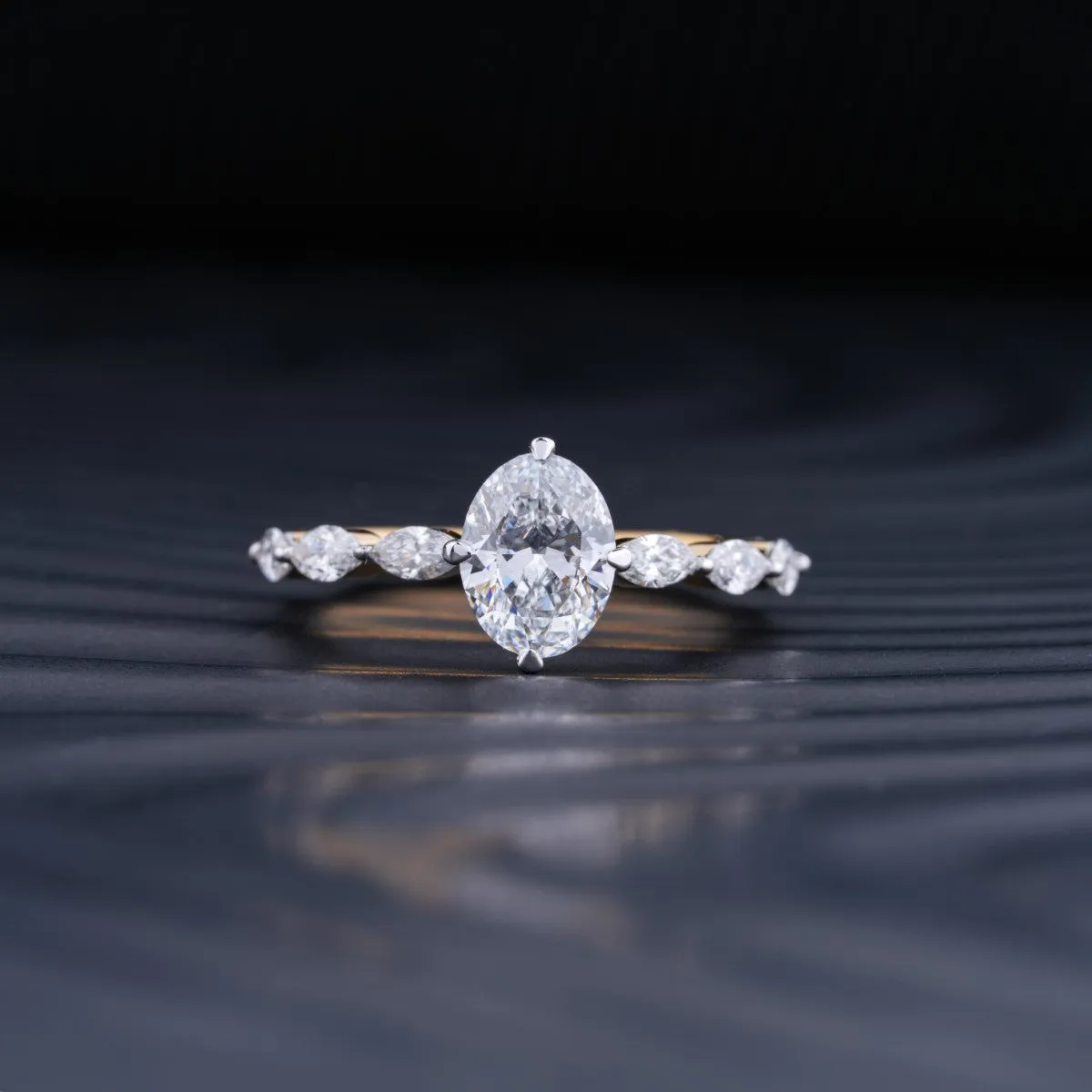 Oval Diamond Ring With Marquise Side Stones