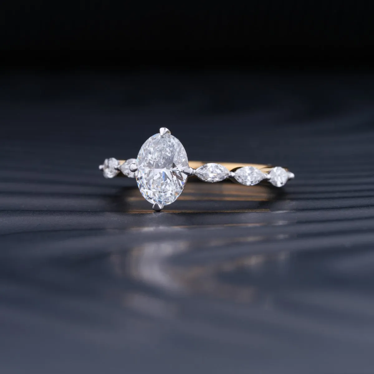 Oval Diamond Ring With Marquise Side Stones